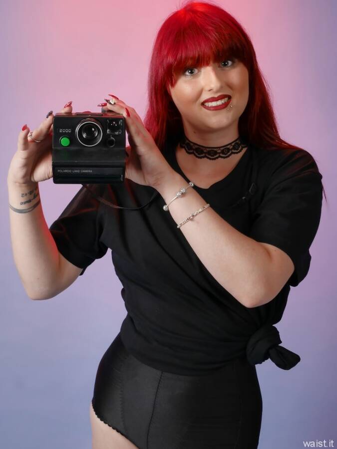photographer waist it pinup modelling photo. the lovely danni with her beautiful long red hair pointing my 1970s vintage poloaroid land camera at us great prop but probably the worst camera i ever used with its horrid plastic lenses and the film pack  just ten