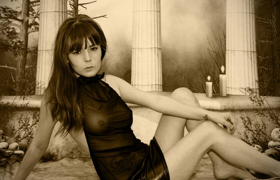 photographer Alan Tog lingerie modelling photo. posing in a black sheer dress gothic themed shoot.