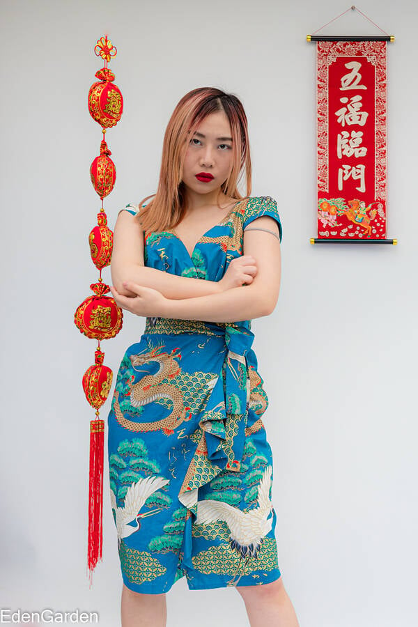 photographer EdenGarden lifestyle modelling photo. model translated the scroll as five lots of luck and the hanger as riches will come my way can039t wait.