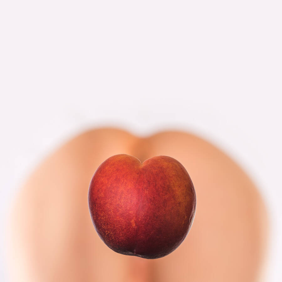 photographer flashtestdummy erotic modelling photo. retouched to remove the support holding the peach in place.